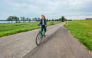 Cycling on a dyke at the Rhine
