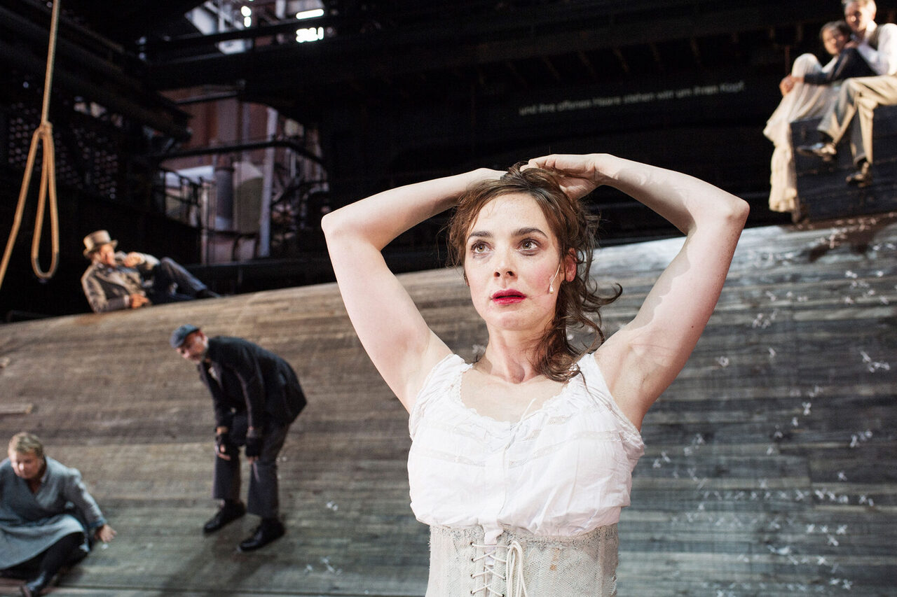 A peformance against an industrial backdrop