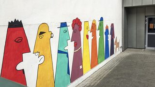 Bild einer bemalten Wand am Bürgerhaus Neumühl